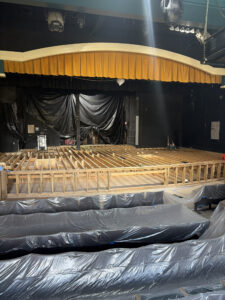 The stage rebuild in progress with new joists and new subfloors.