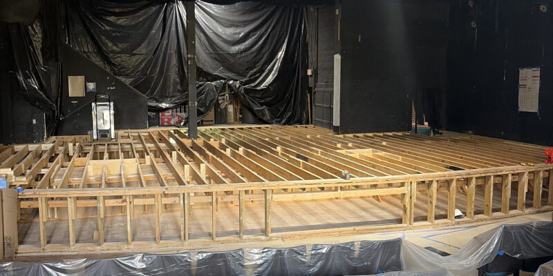 The stage rebuild in progress with new joists and new subfloors.