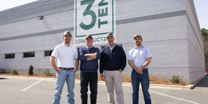 Three partners and one founding member of 3TEN Construction standing outside the Charlotte office.
