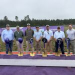 3TEN Construction team standing in front of golden shovels and Novant's signature purple sand for the ceremonial ground breaking.