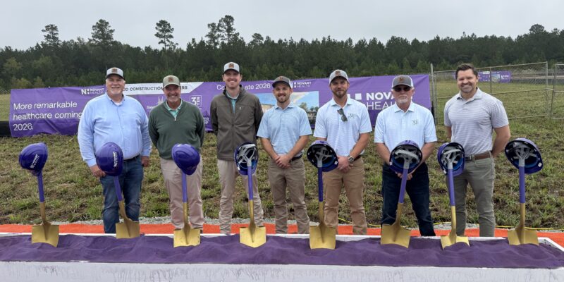 3TEN Construction team standing in front of golden shovels and Novant's signature purple sand for the ceremonial ground breaking.